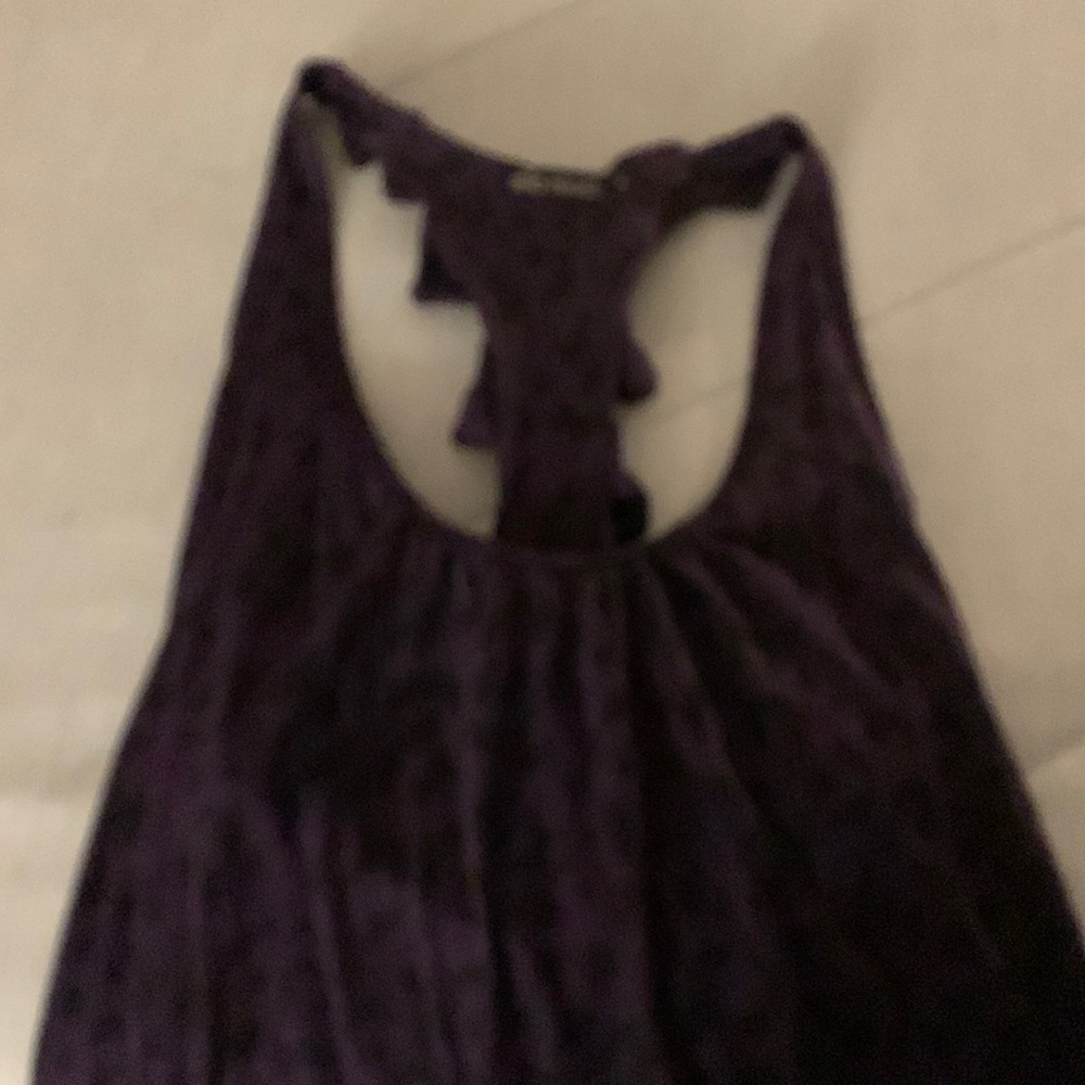 dressy tank top that poofs out a bit on bottom and has round neck ,cross down ?